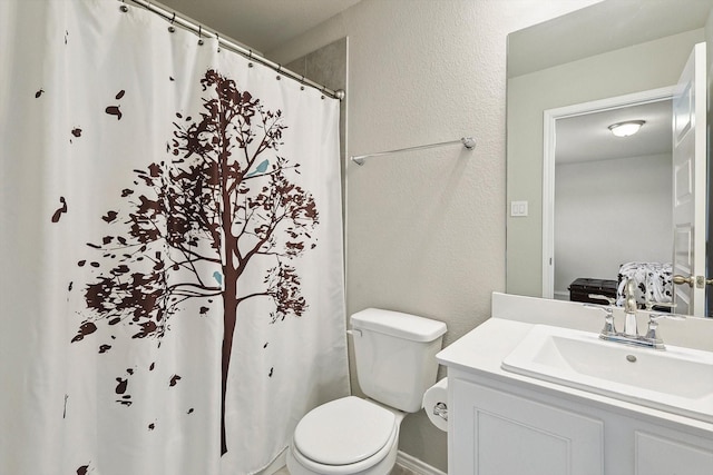 1608 Star Fleet Dr, Haslet, TX 76052 - ensuite bathroom featuring toilet, vanity, a textured wall, and a shower with shower curtain