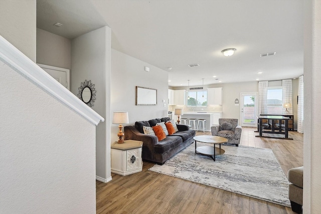 1608 Star Fleet Dr, Haslet, TX 76052 - living area with light wood-style floors and baseboards