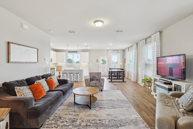 1608 Star Fleet Dr, Haslet, TX 76052 - living area with light wood-style floors and recessed lighting