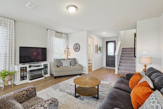 1608 Star Fleet Dr, Haslet, TX 76052 - living room with wood finished floors, stairway, and baseboards