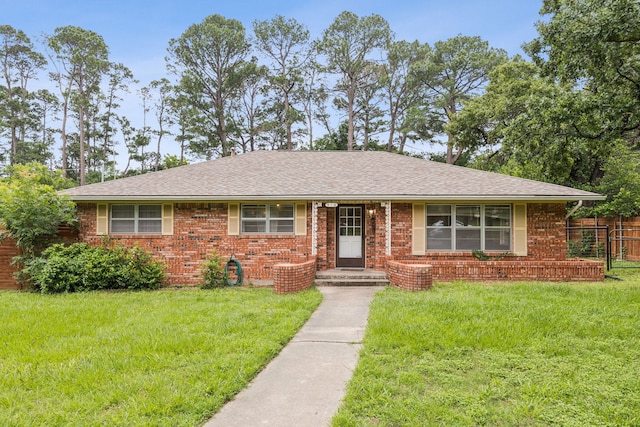 916 Edgewood Pl, Denton, TX 76209 - view of front of home featuring brick siding and a shingled roof