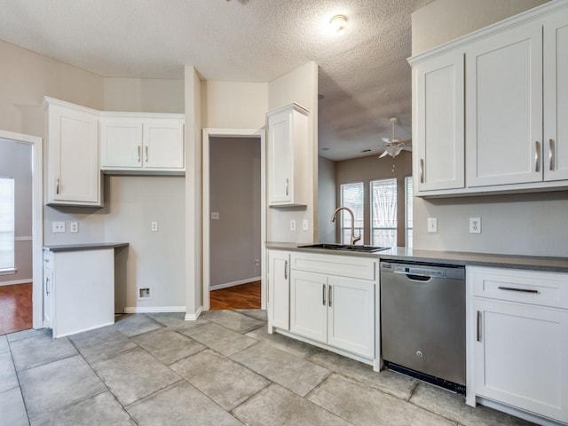 18851 Park Grove Ln, Dallas, TX 75287 - kitchen featuring dishwasher, a sink, a ceiling fan, a textured ceiling, and white cabinetry