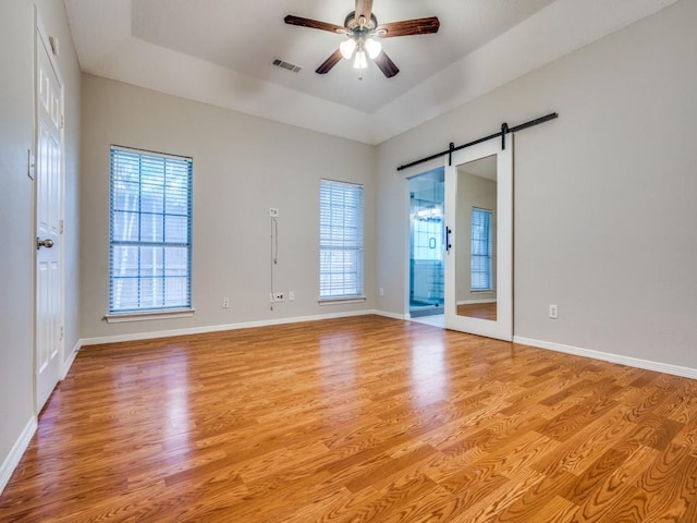 18851 Park Grove Ln, Dallas, TX 75287 - spare room featuring healthy amount of natural light and light wood finished floors
