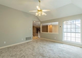 2909 Harkness Dr, Plano, TX 75093 - unfurnished living room with lofted ceiling, carpet floors, plenty of natural light, baseboards, and ceiling fan