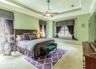 2909 Harkness Dr, Plano, TX 75093 - bedroom featuring crown molding, a tray ceiling, carpet flooring, ceiling fan, and baseboards