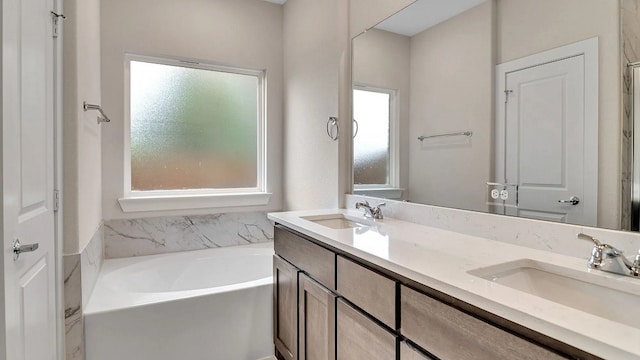 1524 Latimer Ct, Trenton, TX 75490 - bathroom featuring a garden tub and double vanity