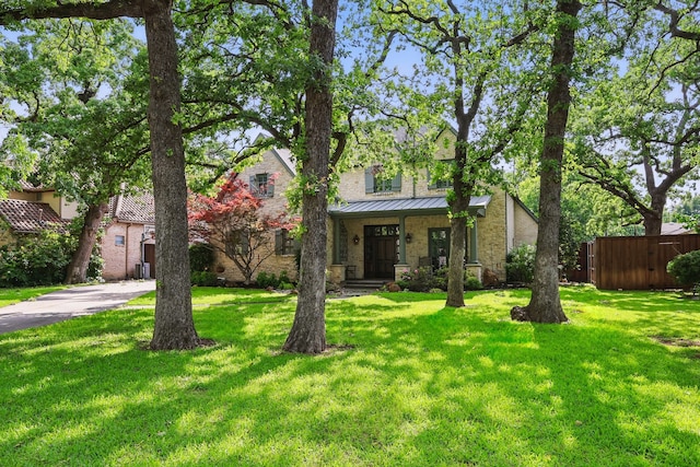 129 Shady Dale Ln, Coppell, TX 75019 - view of front of property with a standing seam roof, stone siding, and brick siding