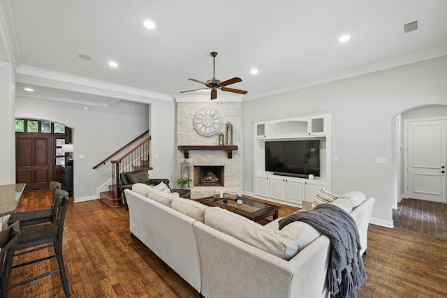 129 Shady Dale Ln, Coppell, TX 75019 - living area featuring a ceiling fan, recessed lighting, dark wood-type flooring, a large fireplace, and stairs