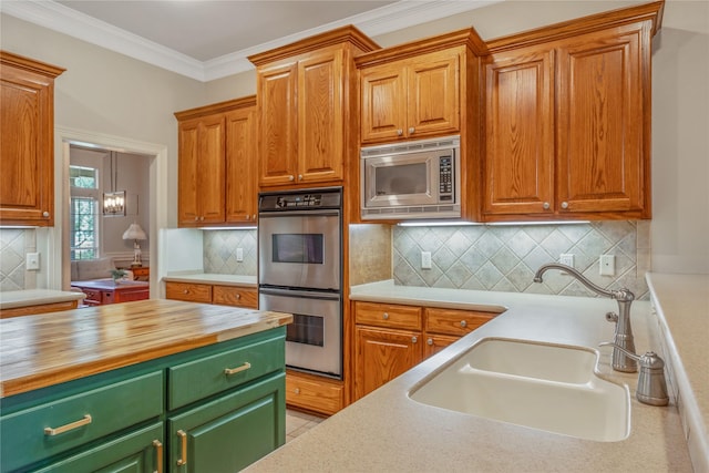 11240 Marsh Wren Cir, Flint, TX 75762 - kitchen featuring appliances with stainless steel finishes, a sink, wooden counters, backsplash, and ornamental molding