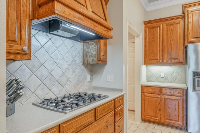 11240 Marsh Wren Cir, Flint, TX 75762 - kitchen featuring appliances with stainless steel finishes, custom range hood, tasteful backsplash, ornamental molding, and light countertops