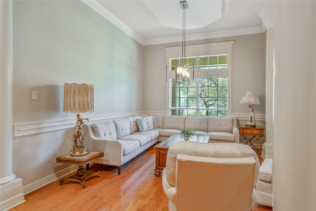 11240 Marsh Wren Cir, Flint, TX 75762 - living area featuring light wood-style floors, ornamental molding, a chandelier, decorative columns, and a textured wall