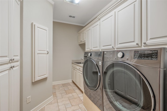 11240 Marsh Wren Cir, Flint, TX 75762 - laundry area featuring washing machine and dryer, cabinet space, baseboards, and crown molding