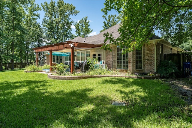 11240 Marsh Wren Cir, Flint, TX 75762 - back of property featuring a pergola, brick siding, and roof with shingles