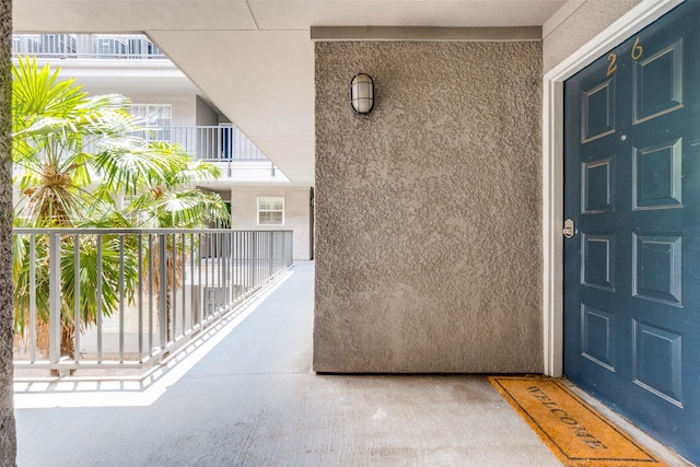 4303 Buena Vista St Unit 206, Dallas, TX 75205 - doorway to property with stucco siding and a balcony