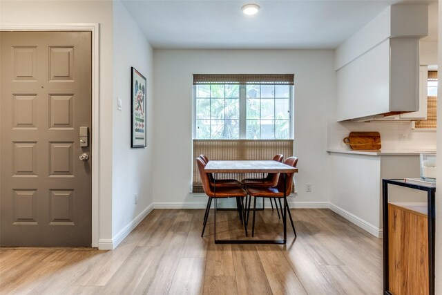 4303 Buena Vista St Unit 206, Dallas, TX 75205 - dining space featuring light wood-style floors and baseboards