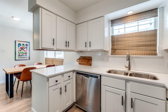 4303 Buena Vista St Unit 206, Dallas, TX 75205 - kitchen featuring dishwasher, a sink, plenty of natural light, tasteful backsplash, and recessed lighting