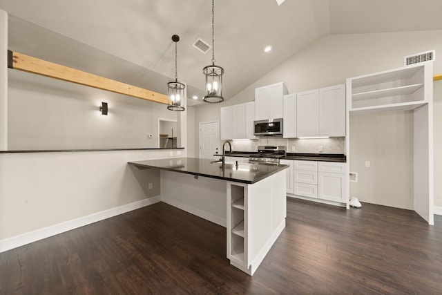 407 Charleston Park Dr, Woodway, TX 76712 - kitchen featuring open shelves, appliances with stainless steel finishes, dark countertops, tasteful backsplash, and high vaulted ceiling