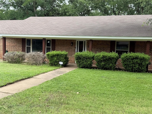 504 Cedar St, Mineral Wells, TX 76067 - single story home with brick siding, a front lawn, and roof with shingles