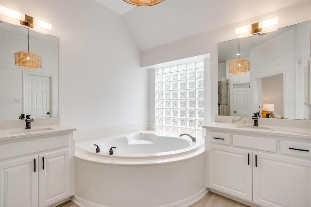 2006 Timber Cove Ct, Weatherford, TX 76087 - full bath with vaulted ceiling, a bath, two vanities, and an enclosed shower
