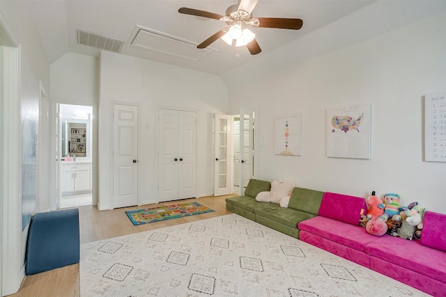 2006 Timber Cove Ct, Weatherford, TX 76087 - living room with a ceiling fan, lofted ceiling, light wood finished floors, and attic access