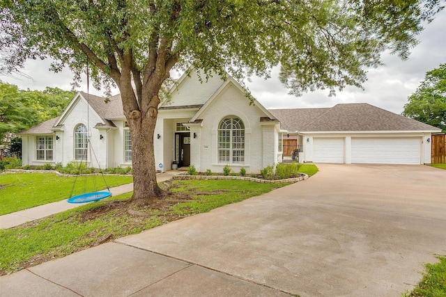 2006 Timber Cove Ct, Weatherford, TX 76087 - view of front of property with a front lawn, concrete driveway, a garage, and a shingled roof