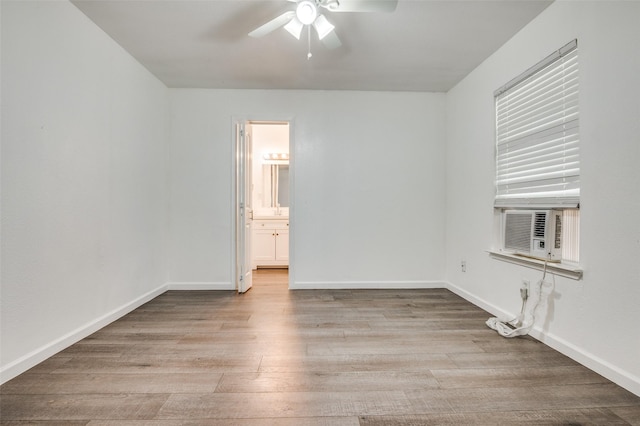 7130 Sorcey Rd, Dallas, TX 75249 - spare room with a ceiling fan, wood finished floors, baseboards, and cooling unit