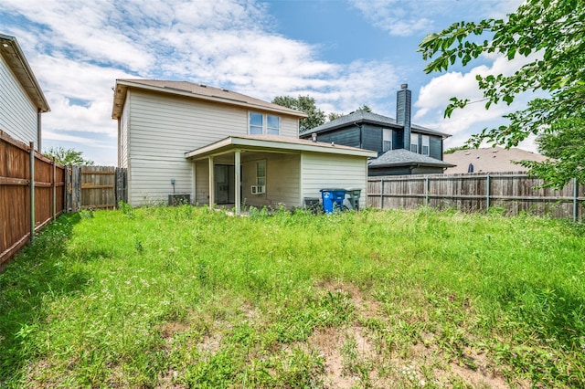 7130 Sorcey Rd, Dallas, TX 75249 - back of house featuring a fenced backyard and central AC