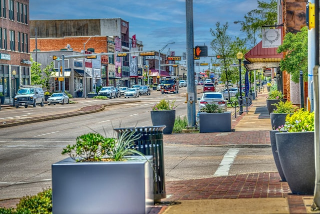 914 S Frances St, Terrell, TX 75160 - view of asphalt road with street lights, sidewalks, curbs, and traffic lights