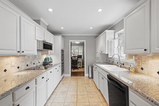 612 Twilight Trl, Richardson, TX 75080 - kitchen featuring black appliances, healthy amount of natural light, white cabinets, ornamental molding, and decorative backsplash