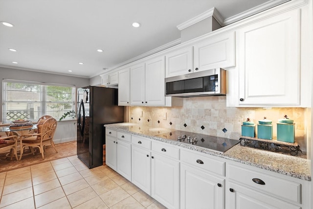612 Twilight Trl, Richardson, TX 75080 - kitchen featuring black appliances, crown molding, white cabinetry, light tile patterned floors, and tasteful backsplash