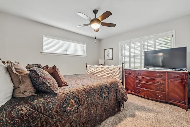 612 Twilight Trl, Richardson, TX 75080 - bedroom with multiple windows, light colored carpet, and a ceiling fan