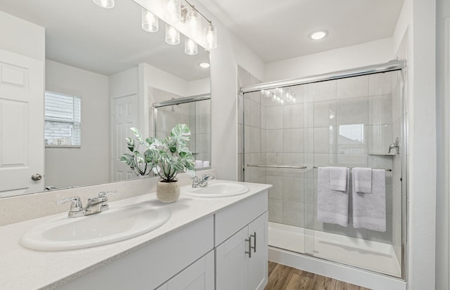 2808 Pecan Park Dr, Denton, TX 76208 - full bathroom featuring double vanity, a shower stall, and wood finished floors