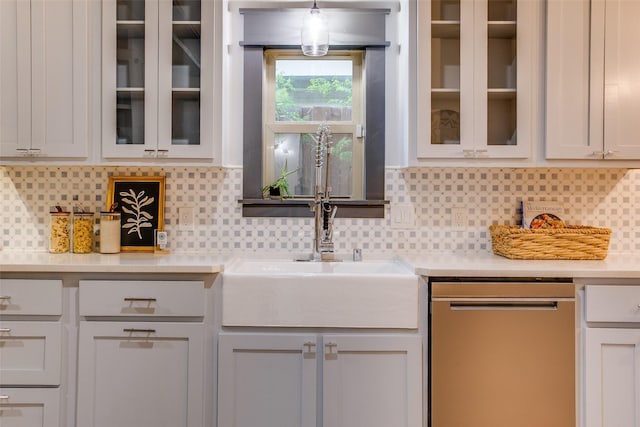 936 N Windomere Ave, Dallas, TX 75208 - kitchen featuring dishwasher, light countertops, backsplash, and glass insert cabinets