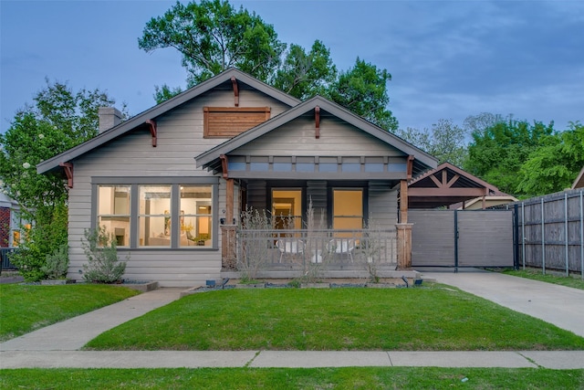 936 N Windomere Ave, Dallas, TX 75208 - view of front of house featuring driveway, a chimney, and covered porch