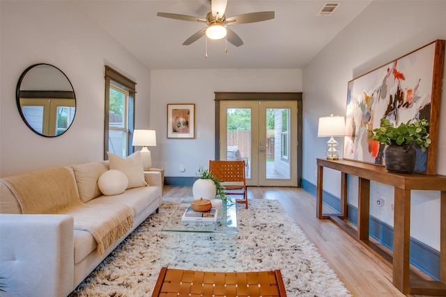 936 N Windomere Ave, Dallas, TX 75208 - living room featuring french doors, light wood-style floors, and ceiling fan