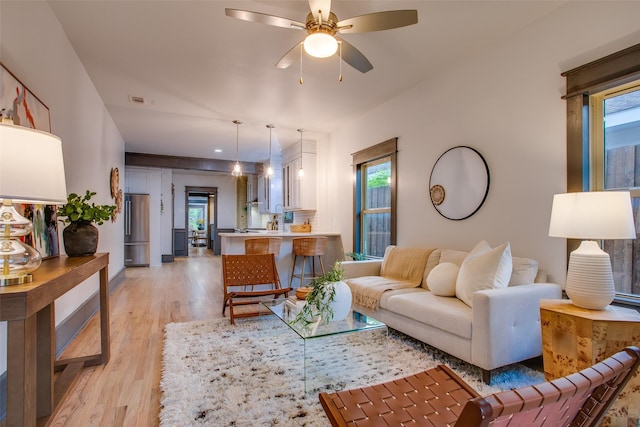 936 N Windomere Ave, Dallas, TX 75208 - living room with a ceiling fan and light wood-style flooring