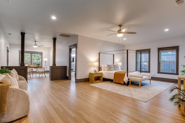936 N Windomere Ave, Dallas, TX 75208 - bedroom with light wood-type flooring, recessed lighting, and ornate columns