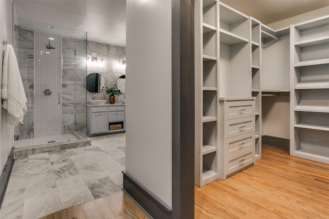 936 N Windomere Ave, Dallas, TX 75208 - walk in closet with light wood-style flooring