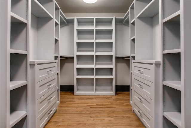936 N Windomere Ave, Dallas, TX 75208 - walk in closet featuring light wood-type flooring