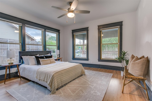 936 N Windomere Ave, Dallas, TX 75208 - bedroom featuring wood finished floors and a ceiling fan
