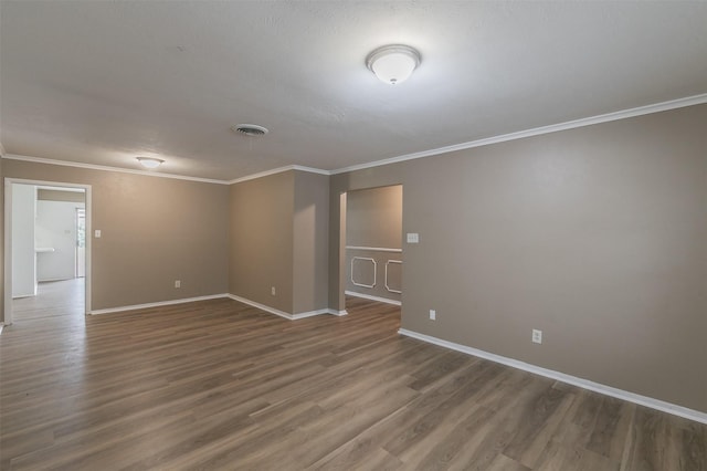 5113 S Drive, Fort Worth, TX 76132 - empty room with wood finished floors, crown molding, and baseboards
