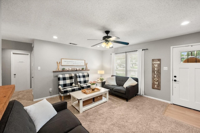 3809 Springtime Ct, Arlington, TX 76017 - living room featuring ceiling fan, a textured ceiling, light colored carpet, recessed lighting, and baseboards
