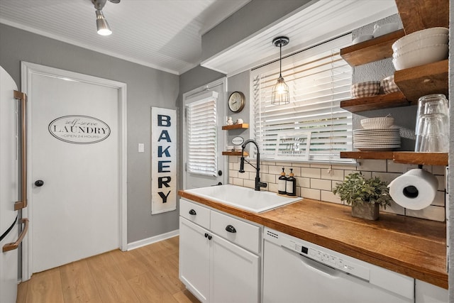 3809 Springtime Ct, Arlington, TX 76017 - kitchen with open shelves, white dishwasher, a sink, tasteful backsplash, and white cabinetry