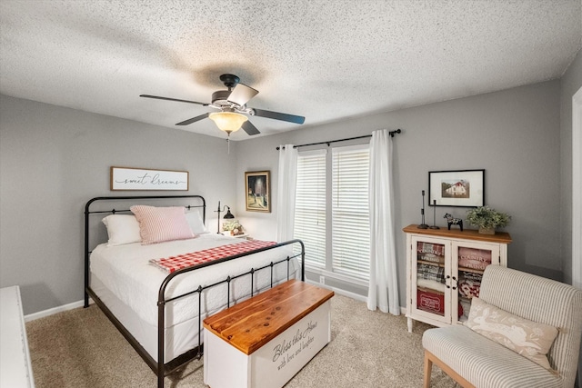 3809 Springtime Ct, Arlington, TX 76017 - bedroom featuring light carpet, ceiling fan, a textured ceiling, and baseboards