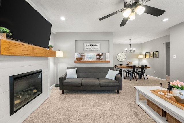 3809 Springtime Ct, Arlington, TX 76017 - carpeted living room featuring a chandelier, a glass covered fireplace, a ceiling fan, recessed lighting, and a textured ceiling
