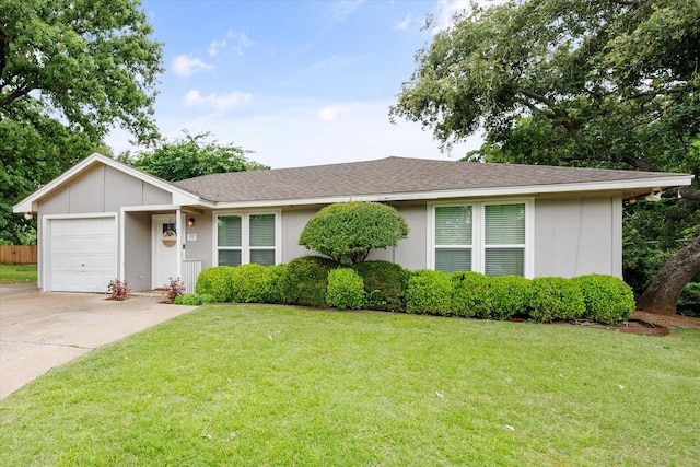 3809 Springtime Ct, Arlington, TX 76017 - view of front of home with an attached garage, a front lawn, concrete driveway, and a shingled roof