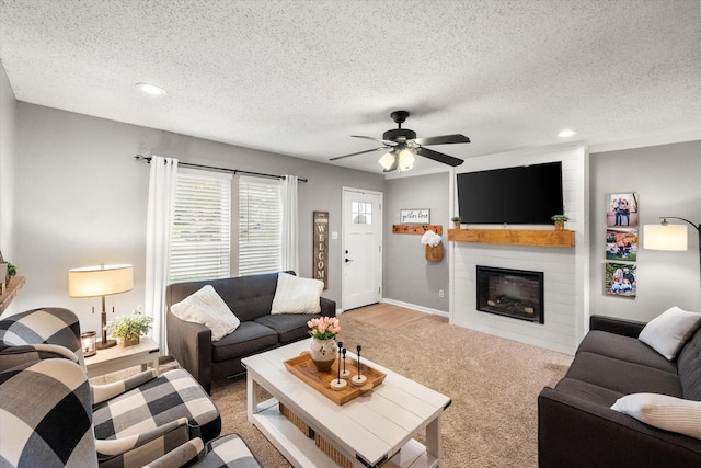 3809 Springtime Ct, Arlington, TX 76017 - living room with a textured ceiling, ceiling fan, a fireplace, recessed lighting, and light carpet