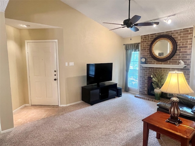 1206 Riverchase Ln Unit 250, Arlington, TX 76011 - living area with carpet flooring, a textured ceiling, ceiling fan, baseboards, and a fireplace