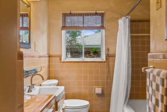 11616 Tuscany Way, Dallas, TX 75218 - full bathroom with toilet, tile walls, vanity, shower / tub combo, and wainscoting