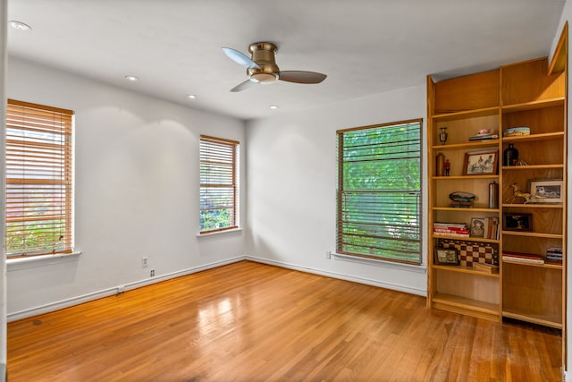 11616 Tuscany Way, Dallas, TX 75218 - spare room with wood finished floors, ceiling fan, baseboards, and recessed lighting